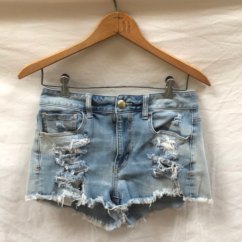 Ripped light wash shorts